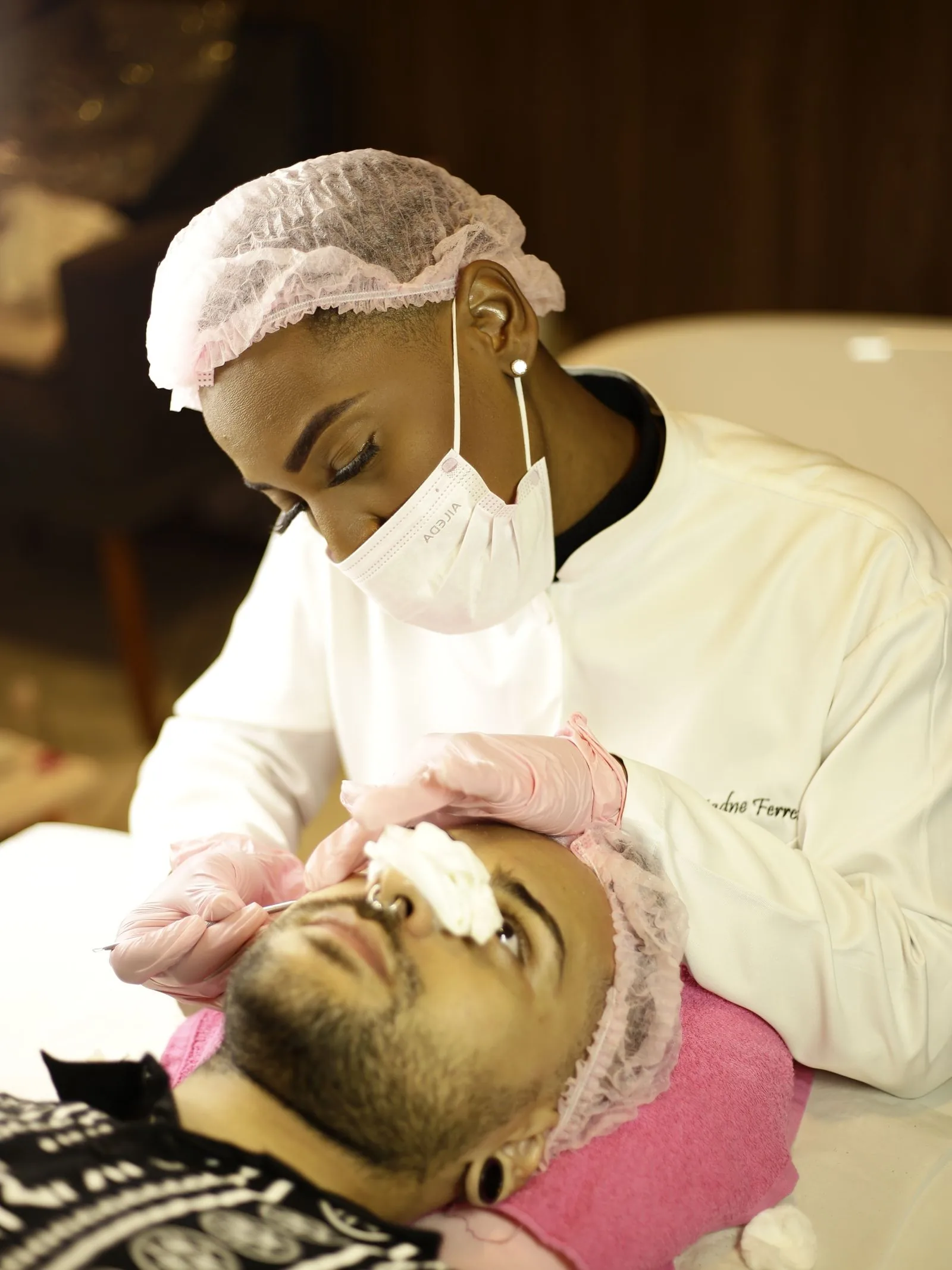 Aesthetic professional providing attentive facial care